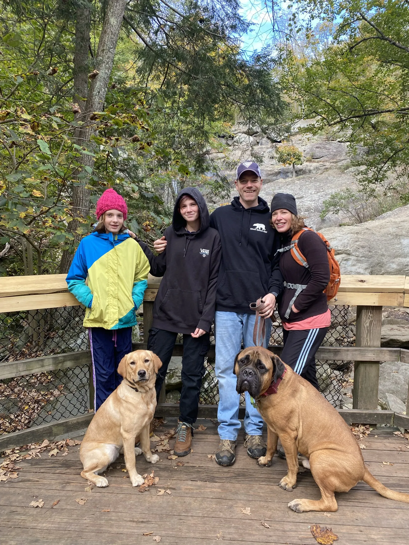 The Kergel family on a hiking trail with Titus and their yellow lab